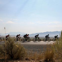 Cyclists ride along SR-73 near Cedar Fort during Stage 4 of the Tour of Utah on Thursday, Aug. 3, 2017.