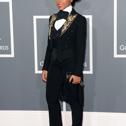 Janelle Monae in an embroidered black tux jacket by Moschino, a Ralph Lauren hat and an Against Nature vest and shirt.
