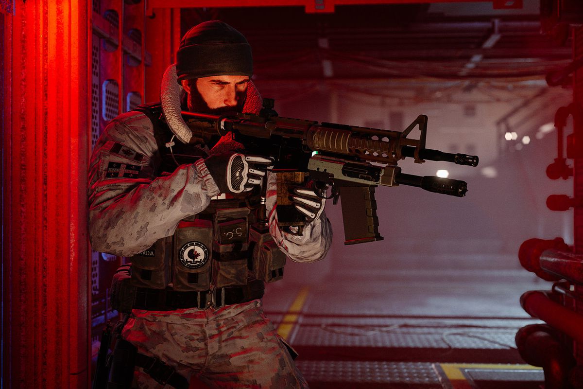 a soldier holding a gun in a red hallway