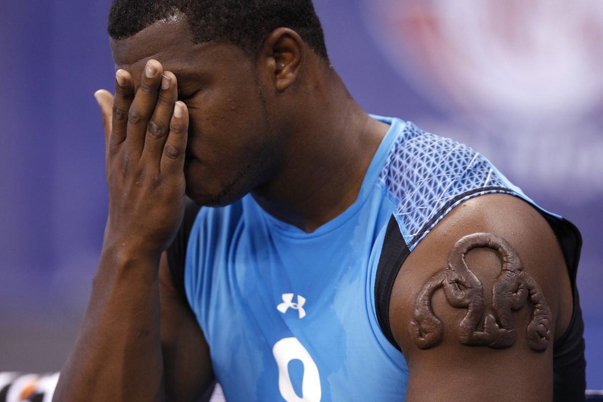 Defensive lineman Quinton Coples of North Carolina wipes his face after workouts during the 2012 NFL Combine at Lucas Oil Stadium on February 27, 2012 in Indianapolis, Indiana. (Photo by Joe Robbins/Getty Images)