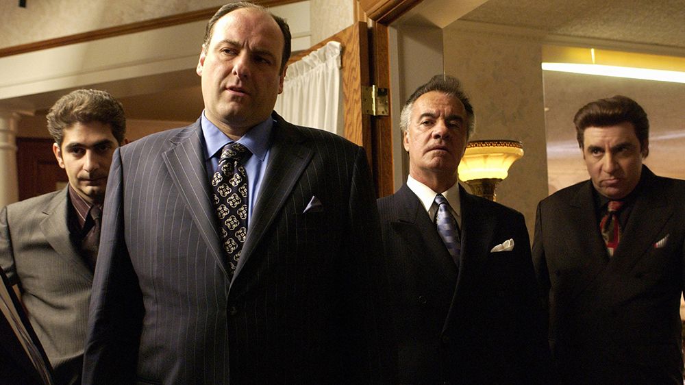 Tony Soprano and co. standing in suits