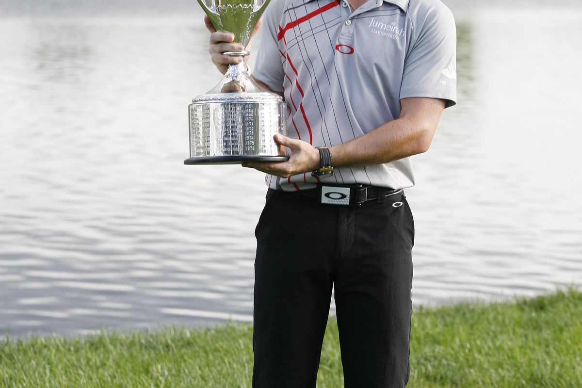 Sep 9, 2012; Carmel, IN, USA; Rory McIlroy poses with the Western Golf Association Open Championship Cup after winning the BMW Championship at Crooked Stick Golf Club. Mandatory Credit: Brian Spurlock-US PRESSWIRE