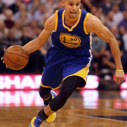 Golden State Warriors guard Stephen Curry drives with the ball in the second half of an NBA regular season game against the Utah Jazz at the Vivint Arena in Salt Lake City, Wednesday, March 30, 2016.