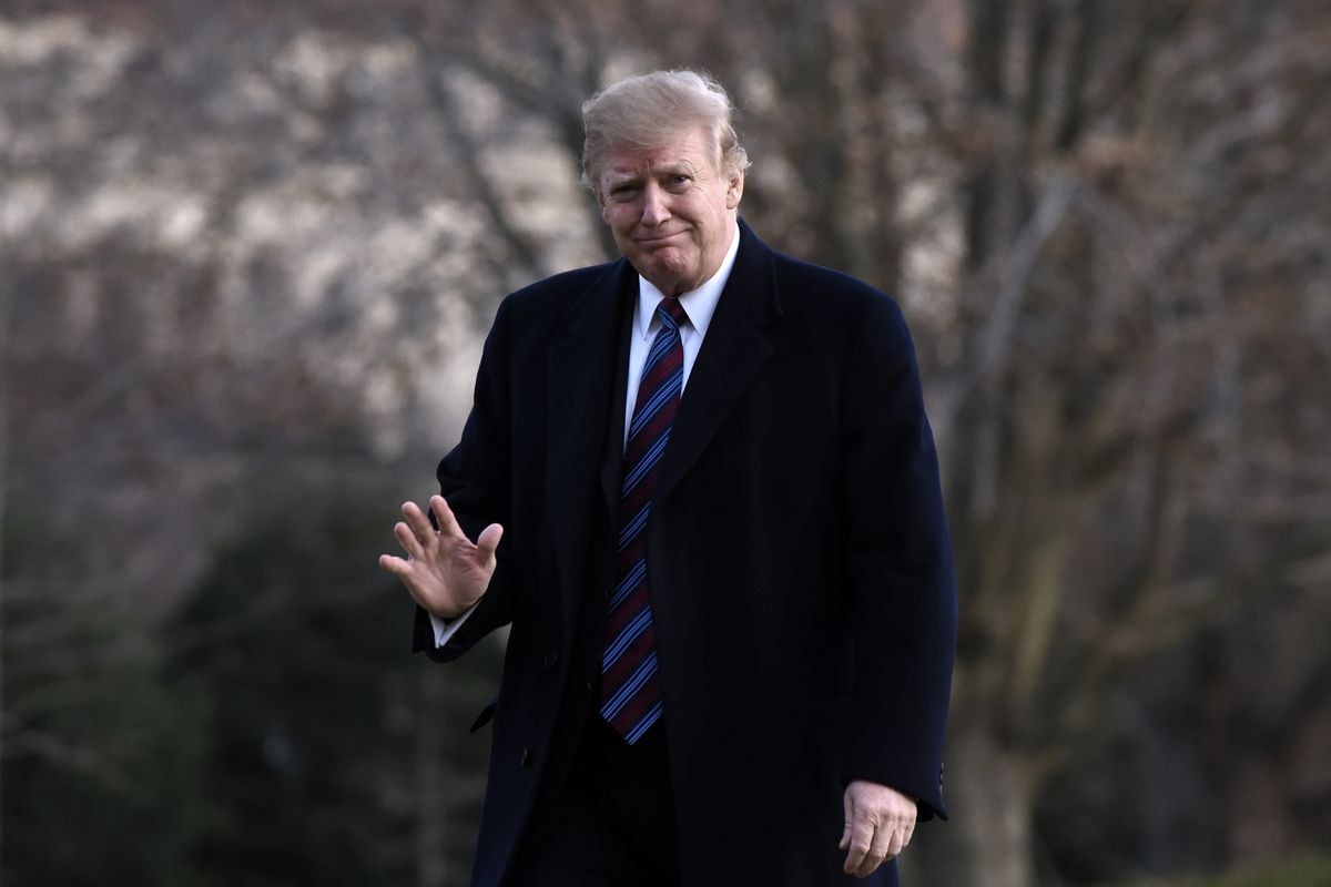President Donald Trump waves to reporters upon returning to the White House in February 2019.
