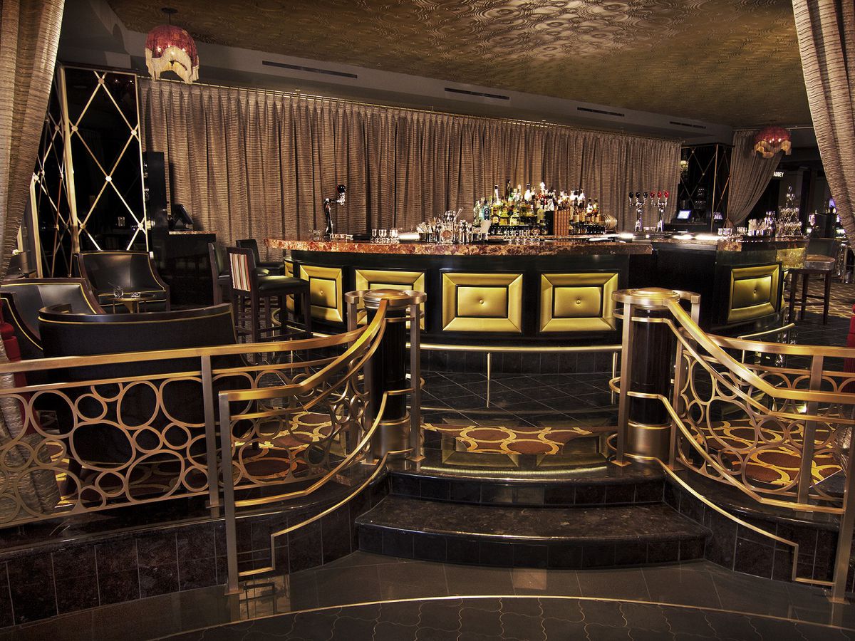 An Art Deco-inspired bar with brass touches