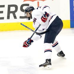 UConn's Philip Nyberg (26) breaks his stick on a shot during the Northeastern Huskies vs UConn Huskies men's college ice hockey game game at the XL Center in Hartford, CT  on November 28, 2017.