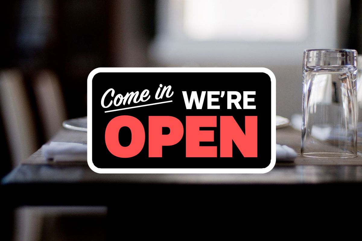 A “come on in we’re open” sign logo over a nondescript restaurant stock photo.