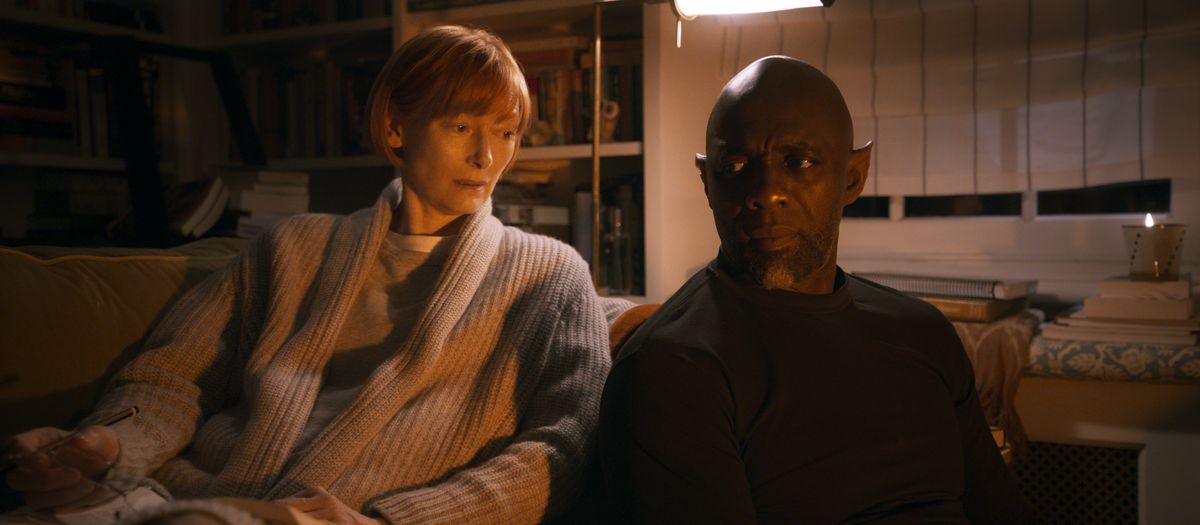 Tilda Swinton and Idris Elba with pointy ears sit next to each other in George Miller’s Three Thousand Years of Longing.