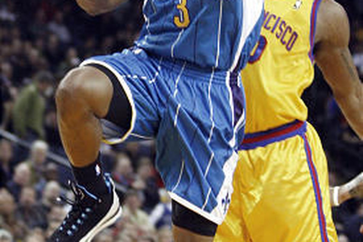 In this Jan. 27, 2010, file photo, New Orleans Hornets' Chris Paul (3) lays up a shot past Golden State Warriors' Cartier Martin during the first half of an NBA basketball game, in Oakland, Calif.  Paul is out indefinitely with a left knee injury that wil