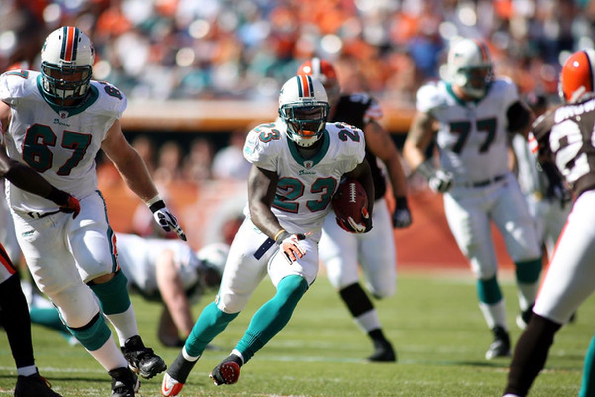 MIAMI FL - DECEMBER 05:  Running back Ronnie Brown #23 of the miami Dolphins carries against the Cleveland Browns at Sun Life Stadium on December 5 2010 in Miami Florida. Cleveland defeated Miami 13-10.  (Photo by Marc Serota/Getty Images)