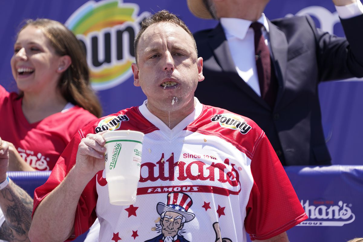 Defending Champion Joey Chestnut competes during the 2021 Nathans Famous Fourth of July International Hot Dog Eating Contest at Coney Island on July 04, 2021 in New York City.
