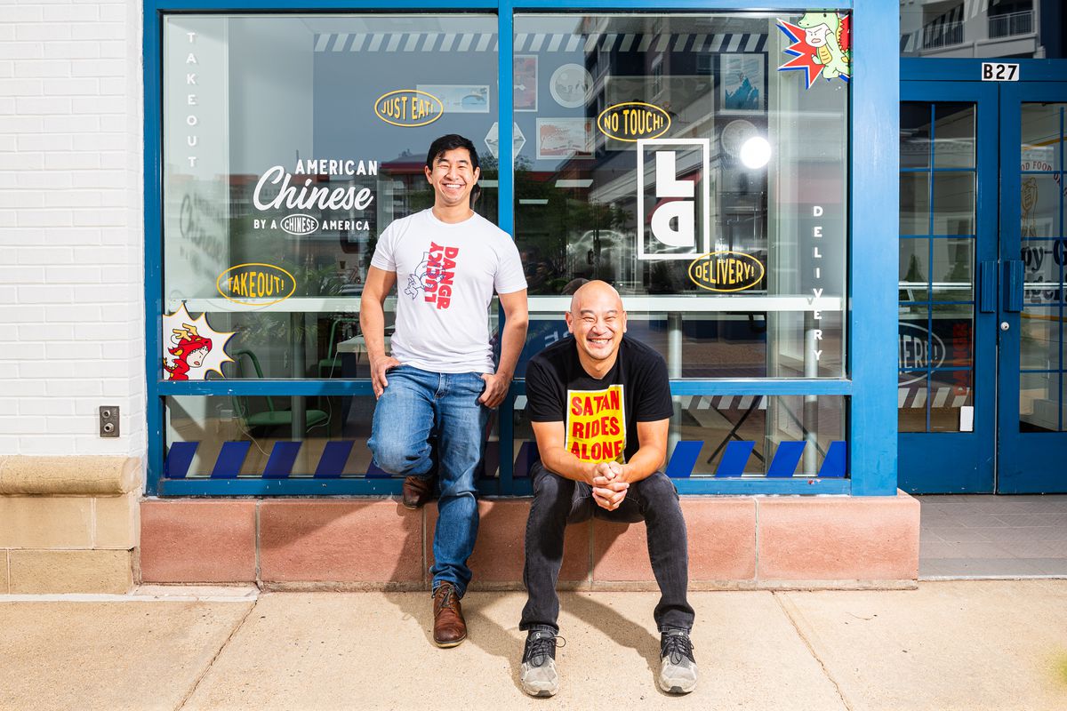 Lucky Danger founders Tim Ma, right, and Andrew Chiou pose in front of their new takeout storefront in Arlington, Virginia