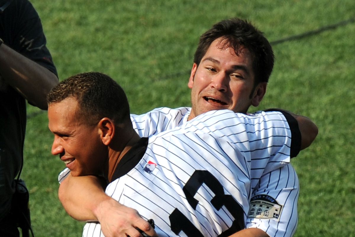 Alex Rodriguez hugs Johnny Damon after he hit the game winni