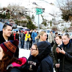 Democrats wait in line across 11th Avenue and up Terrace Hills to attend the Utah Democratic Caucus at Ensign Elementary School in Salt Lake City Tuesday, March 22, 2016.
