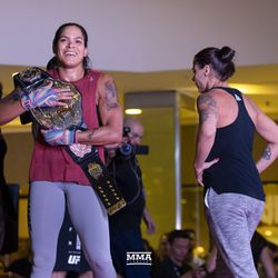Amanda Nunes throws her belt over her shoulder at the UFC 224 open workouts Wednesday inside Barra Shopping Mall in Rio de Janeiro, Brazil.