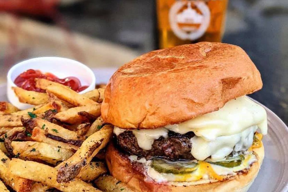 The double cheeseburger with side of herb fries and a pint of Modelo beer from now-closed Woodward and Park in Grant Park Atlanta. 