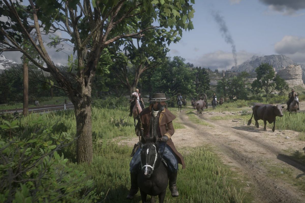 Red Dead Online - players, dressed as cowboys and riding horses, on a private server escort bovine down a dirt road