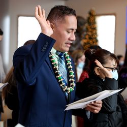 Faaliliu Magalo, who is originally from American Samoa, recites the oath of allegiance, thus becoming an American citizen, during a naturalization ceremony at This Is the Place Heritage Park in Salt Lake City on Thursday, Dec. 16, 2021.