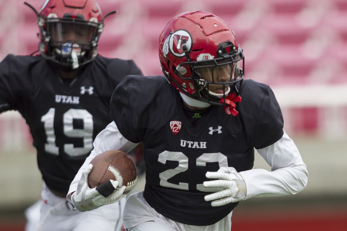 Utah's Julian Blackmon runs with the ball while practicing with the rest of the Utah Utes at Rice-Eccles Stadium in Salt Lake City on Friday, March 30, 2018.