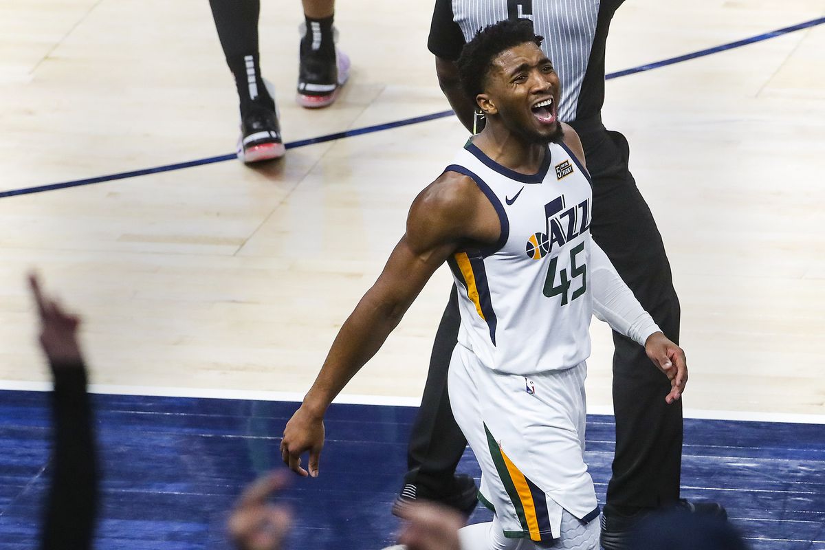 Utah Jazz guard Donovan Mitchell (45) screams to the crowd as after nailing a three-pointer late in the fourth quarter of the Boston Celtics at Utah Jazz NBA basketball game at Vivint Smart Home Arena in Salt Lake City on Tuesday, Feb. 9, 2021.