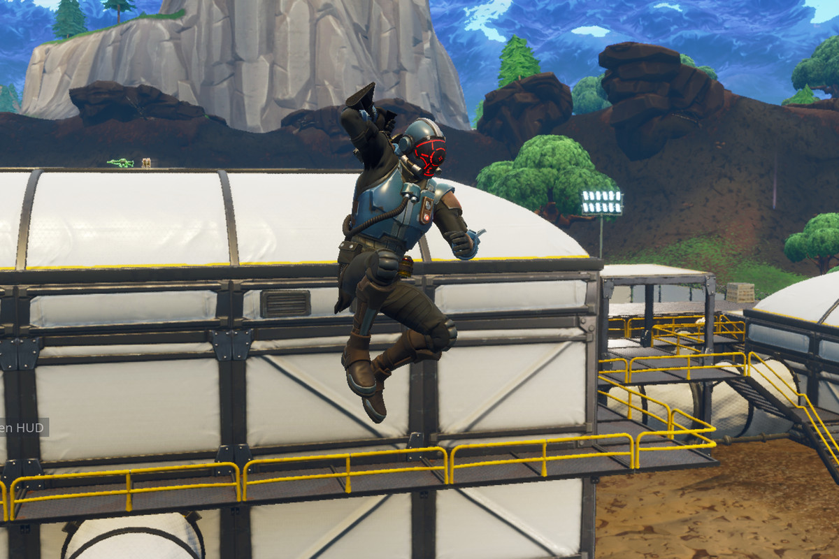 Fortnite - guy jumping down from atop a structure