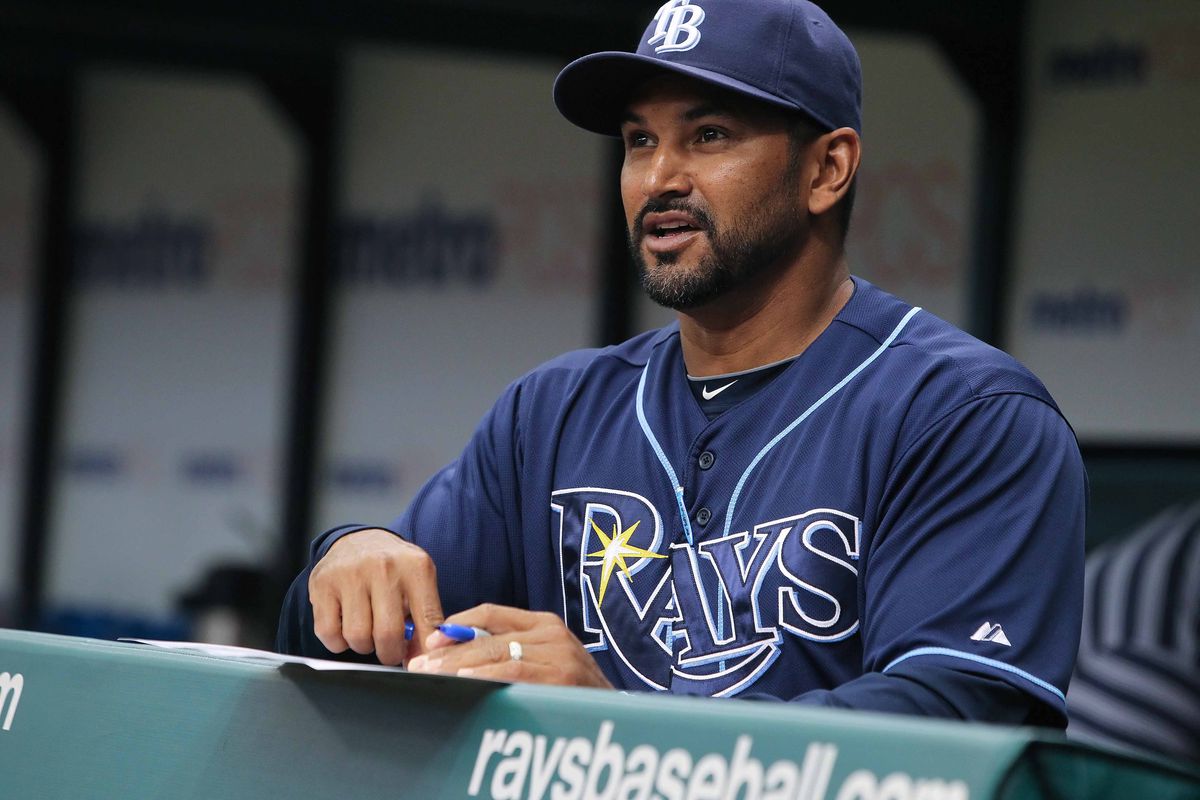 July 19, 2012; St. Petersburg, FL, USA; Tampa Bay Rays bench coach Dave Martinez (4) in the dugout against the Cleveland Indians at Tropicana Field. Tampa Bay Rays defeated the Cleveland Indians 6-0. Mandatory Credit: Kim Klement-US PRESSWIRE