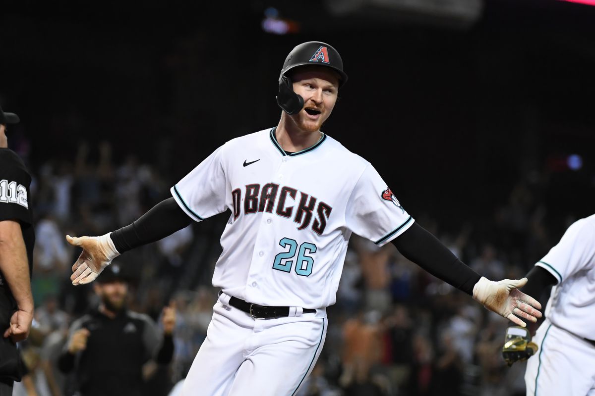 Pavin Smith #22 of the Arizona Diamondbacks celebrates after scoring the winning run on a two-run, walk-off double by Josh Reddick in the 10th inning against the New York Mets at Chase Field on June 01, 2021 in Phoenix, Arizona. Diamondbacks won 6-5.