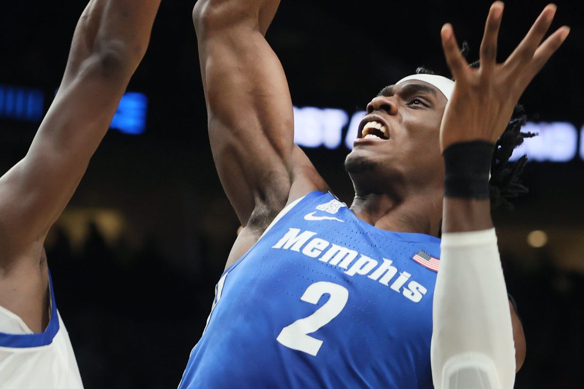 Memphis Tigers center Jalen Duren grabs a rebound over Boise State Broncos forward Abu Kigab during their first round NCAA Tournament matchup on Thursday, March 17, 2022 at the Moda Center in Portland, Ore.