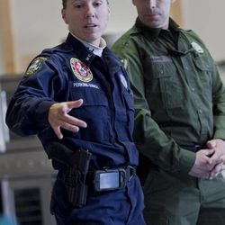State Trooper Diane Perkins-Vance, left, and Game Warden Terry Hughes speak at a news conference after a camp belonging to Christopher Knight was removed from the woods, Thursday, April 11, 2013, in Rome, Maine.  Knight, known as the North Pond Hermit, was arrested Thursday, April 4, 2013, while stealing food at a camp in Rome. Authorities said he may be responsible for more than 1,000 burglaries during his decades in the woods. 