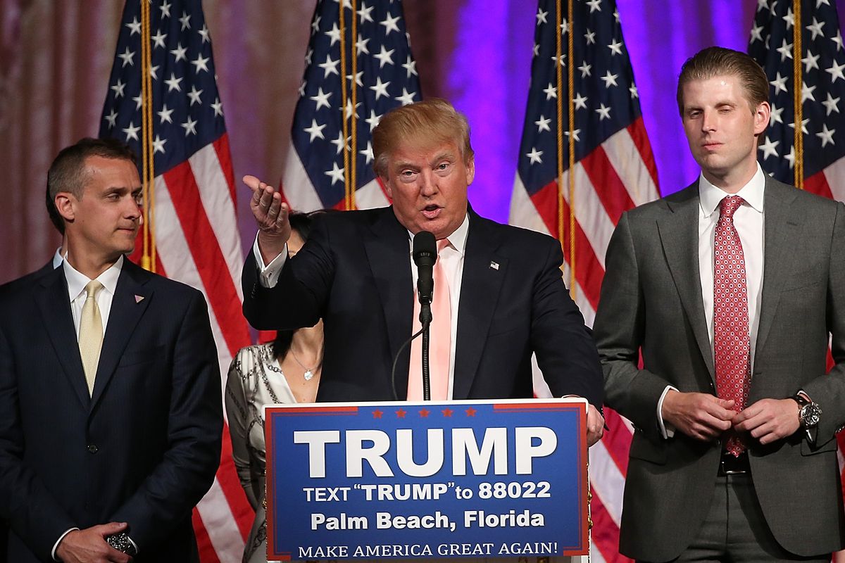 Donald Trump with entourage at a press conference in Mar-a-Lago in March.