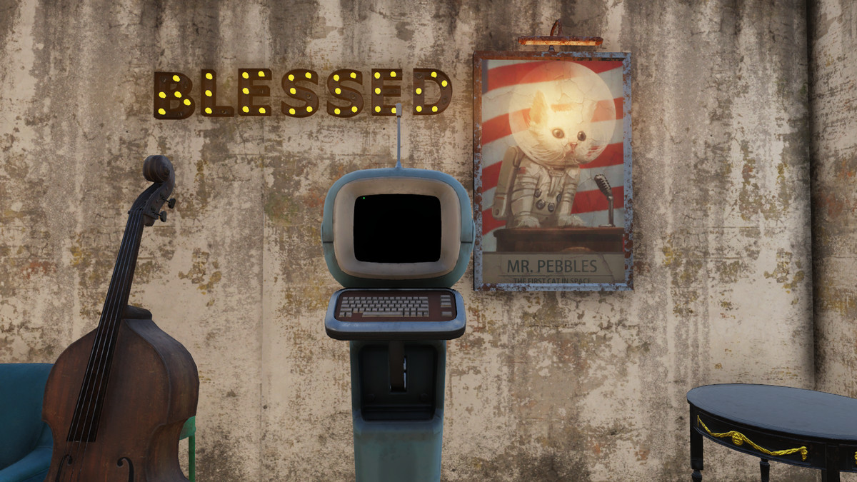 light-up ‘BLESSED’ sign on wall with double bass, computer terminal, and poster of Mr. Pebbles the cat