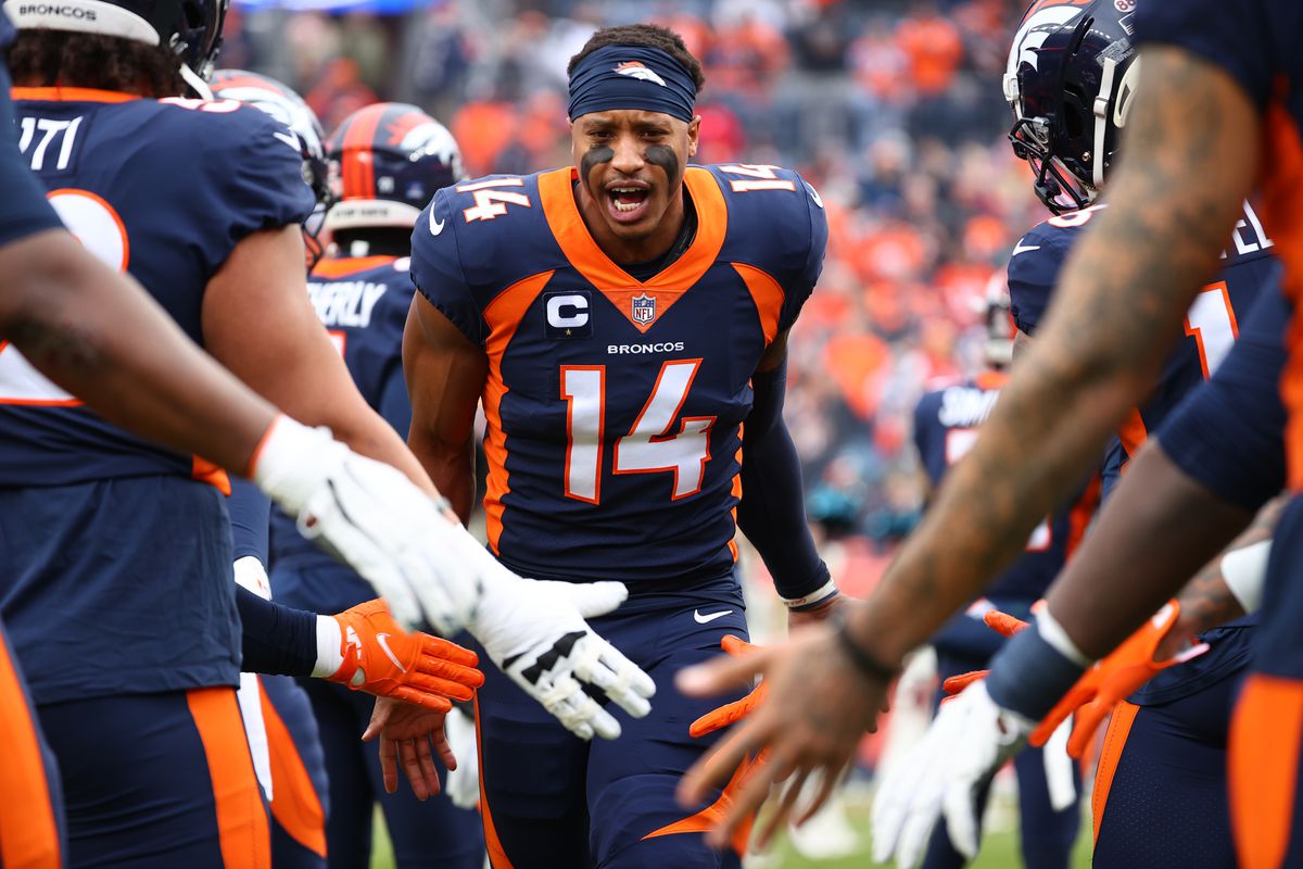 Courtland Sutton #14 of the Denver Broncos high fives teammates prior to facing the Kansas City Chiefs at Empower Field At Mile High on January 08, 2022 in Denver, Colorado.