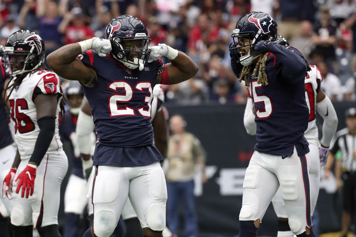 Houston Texans running back Carlos Hyde celebrates with wide receiver Will Fuller after scoring a touchdown during the third quarter against the Atlanta Falcons at NRG Stadium.