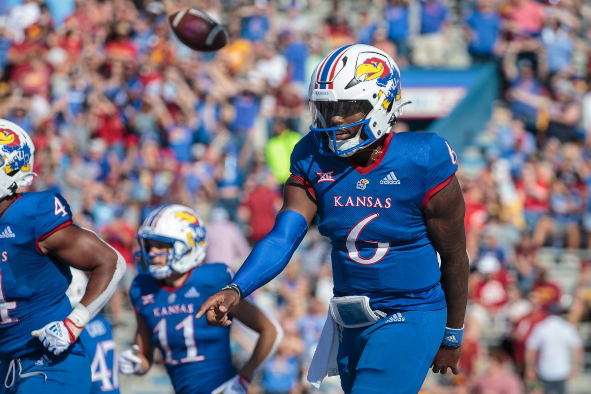 Kansas Jayhawks quarterback Jalon Daniels celebrates in the end zone after scoring a touchdown during the second quarter against the Iowa State Cyclones at David Booth Kansas Memorial Stadium.