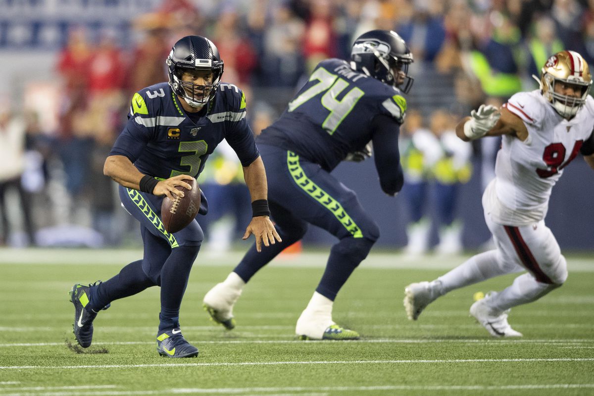 Seattle Seahawks quarterback Russell Wilson looks for an open receiver during during the second against the San Francisco 49ers half at CenturyLink Field.