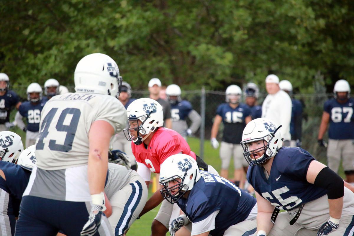 Utah State senior offensive lineman Austin Albrecht (right) participates in fall camp prior to the start of the 2016 season.