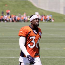 Broncos CB Kayvon Webster walks off the field after signing autographs at the end of the first day of Training Camp.