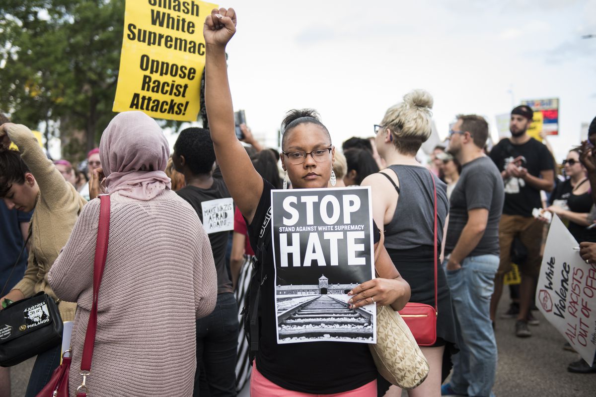 A woman in Minneapolis expresses her solidarity with the anti-white-nationalist protesters in Charlottesville, on August 14.