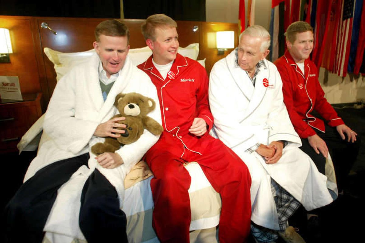 In this 2004 file photo, Stephen Marriott, David Marriott, then-Chairman and CEO of Marriott International Bill Marriott and John Marriott (l-r) sit in pajamas and robes as part of a new bedding promotion. Stephen Garff Marriott, the executive vice presid