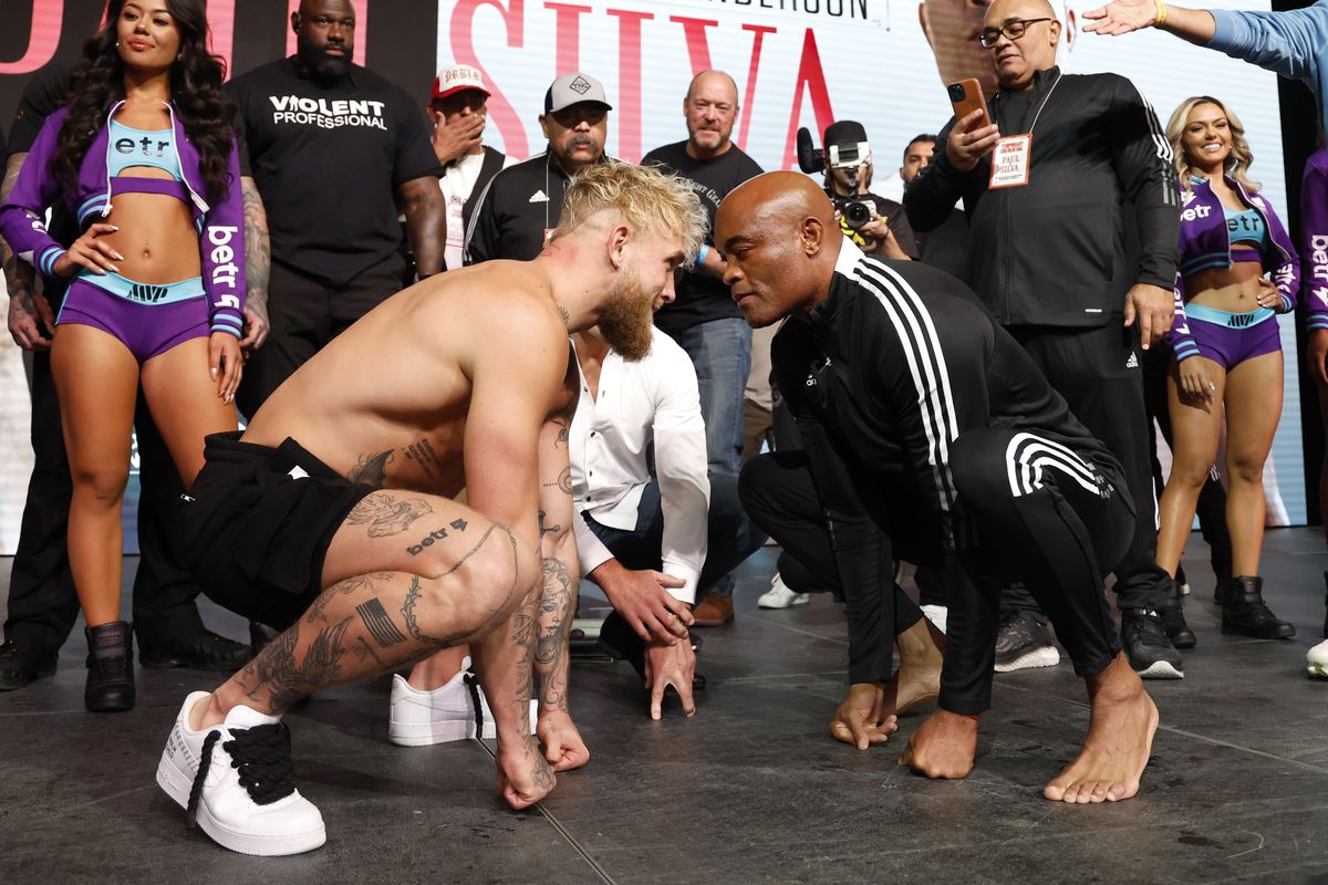 Jake Paul and Anderson Silva at the official weigh-in of their October fight. 