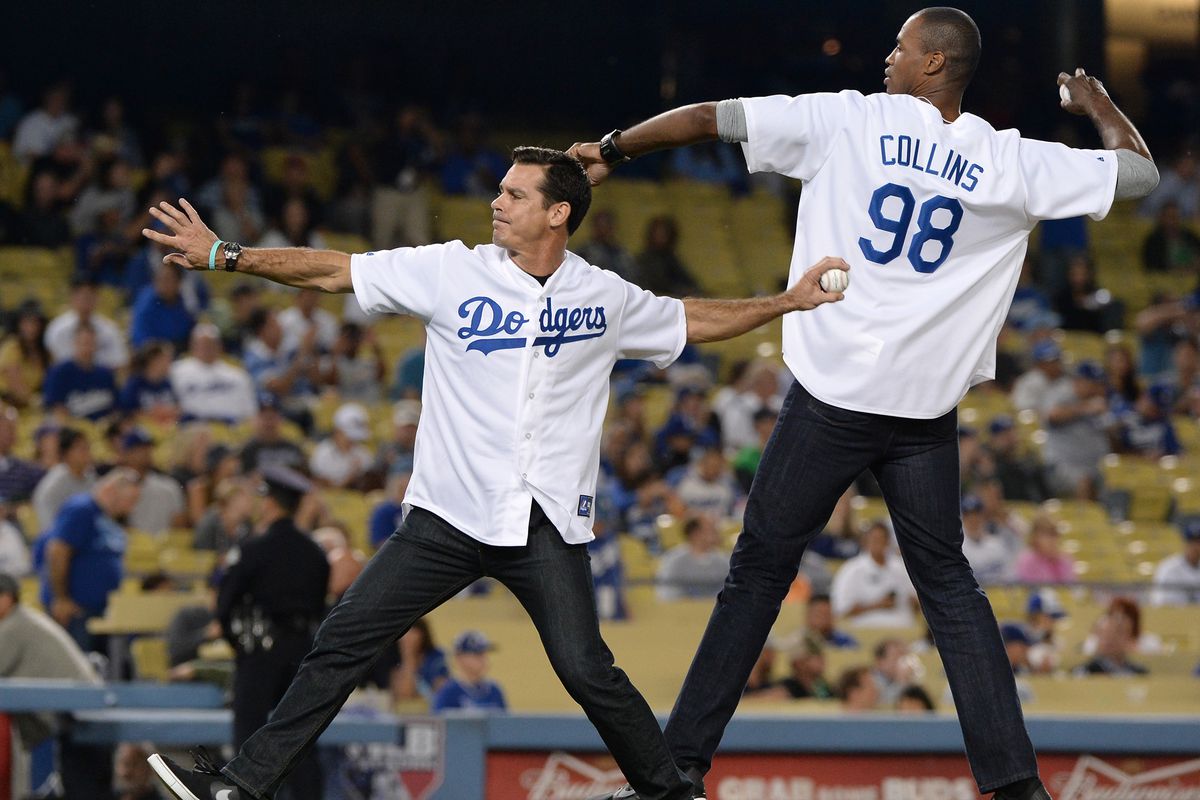 Billy Bean, left, and Jason Collins throw out the first pitcher at Dodger Stadium