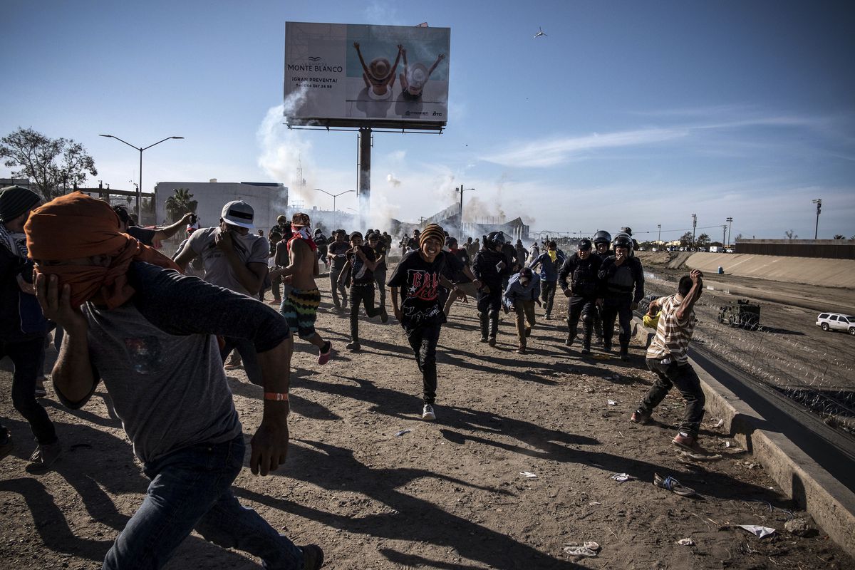 US officials closed the San Ysidro crossing point in southern California on Sunday after hundreds of migrants tried to breach a fence from Tijuana.