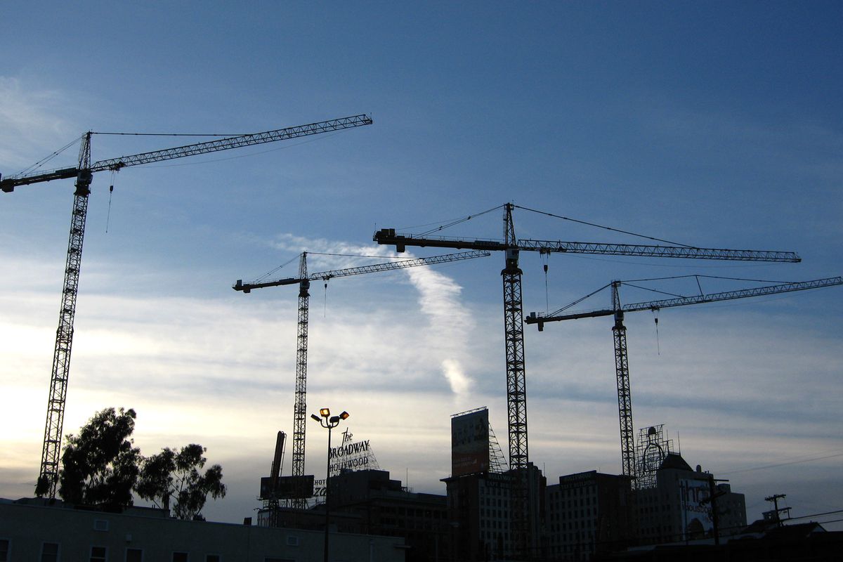 Silhouettes of cranes above Downtown