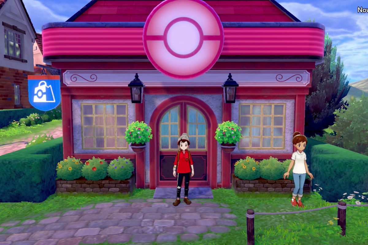 A Pokémon trainer standing in front of a Sword and Shield Pokémon Center