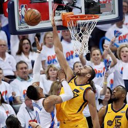 Utah center Rudy Gobert defends a shot by Oklahoma City guard Russell Westbrook as the Jazz and Thunder play in Game 2 of the NBA playoffs in Oklahoma City on Wednesday, April 18, 2018.