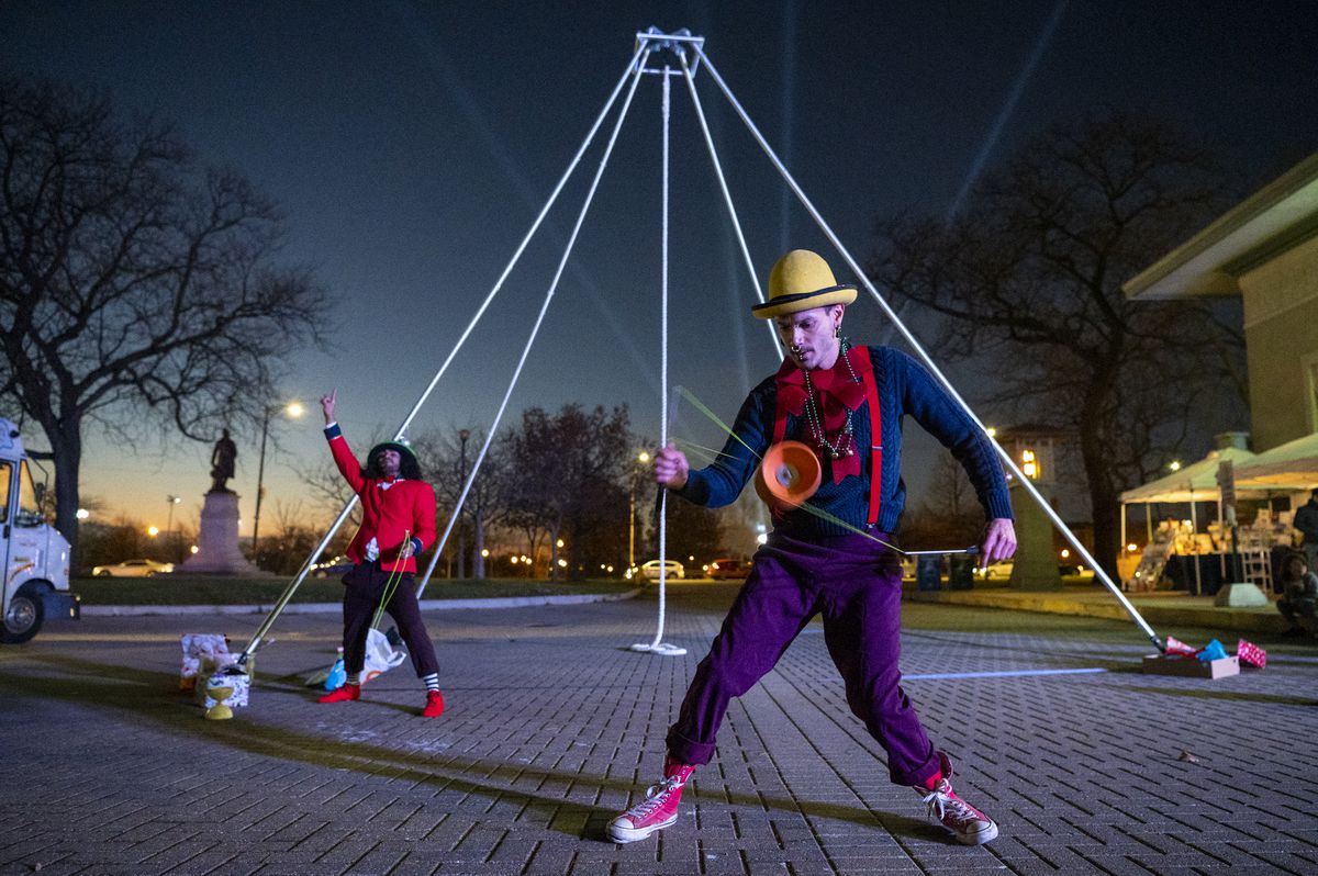 Xavier Claudio, a circus performer with La Vuelta juggles with a Diabolo on Friday at the Humboldt Park boathouse.