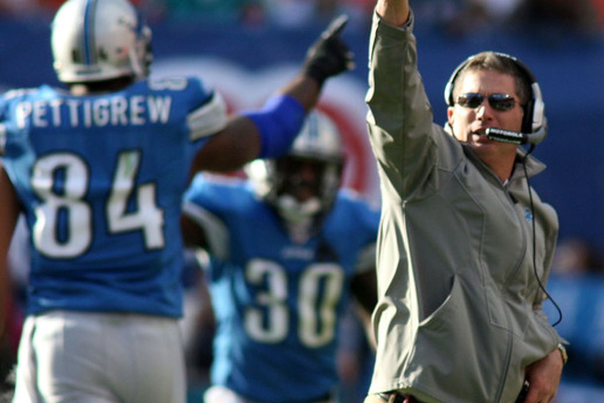 MIAMI - DECEMBER 26: Coach Jim Schwartz of the Detroit Lions celebrates a touchdown against the Miami Dolphins at Sun Life Stadium on December 26 2010 in Miami Florida. The Lions defeated the Dolphins 34-27.  (Photo by Marc Serota/Getty Images)