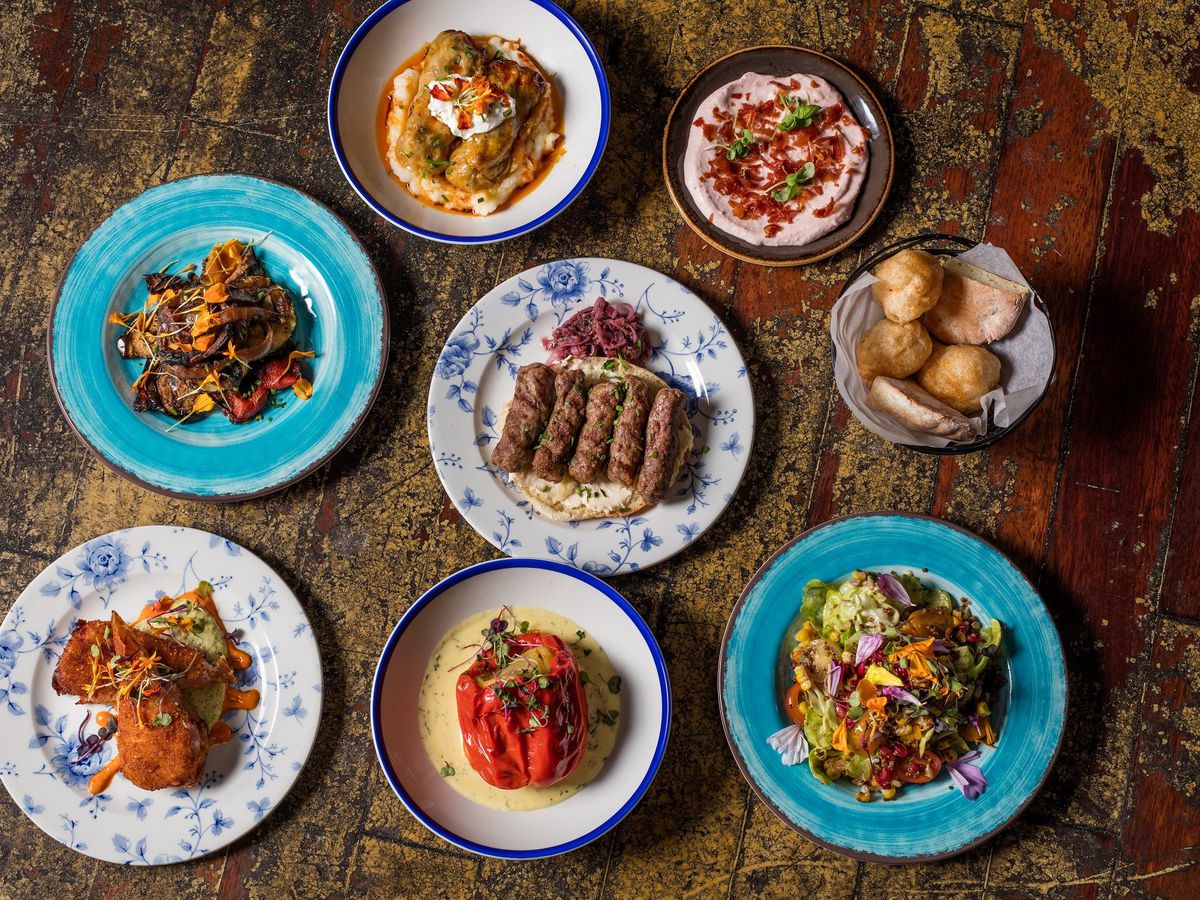 Eight small plates dishes from Ambar on different colored plates.