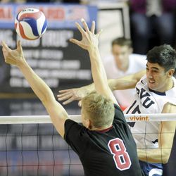 BYU's Taylor Sander (15) gets a kill past Stanford's James Shaw (8) during a match against the Stanford Cardinal Friday, Jan. 24, 2014, at the Smith Fieldhouse in Provo.