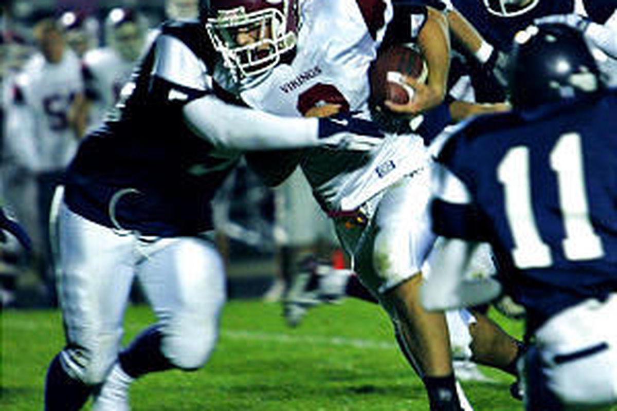 Viewmont's Alex Exon is tackled by Layton's Andrew Bowers in the Lancers' win over the Vikings.